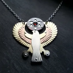 Handcut Egyptian Horus Pendant - holding seed of life red garnet