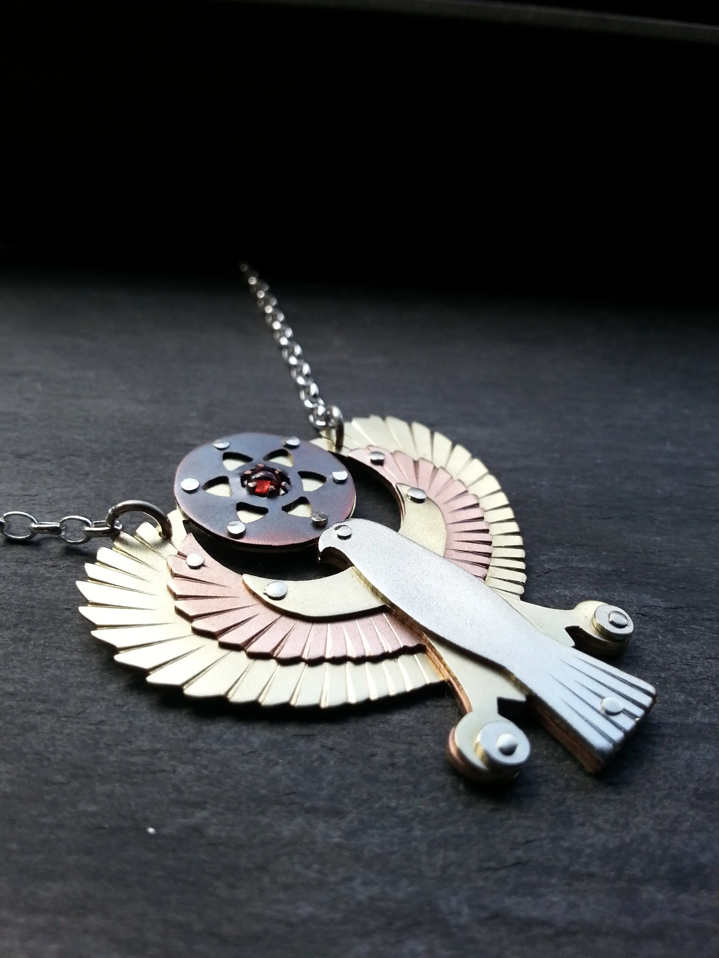 Handcut Egyptian Horus Pendant - holding seed of life red garnet