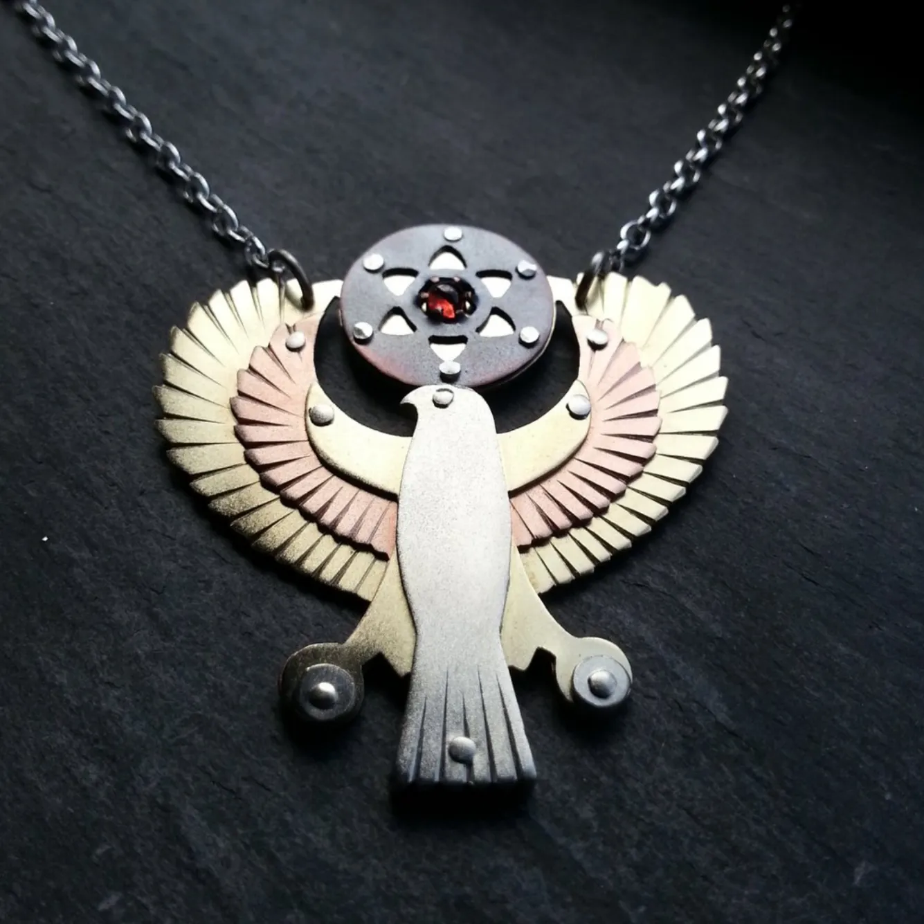 Handcut Egyptian Horus Pendant - holding seed of life red garnet